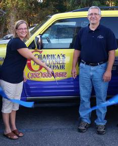 Picture of Owners Charles and Erika doing the cutting of ribbon as a new Chamber of Commerce member